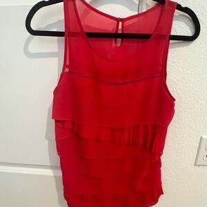 Bright fun summer blouse with multi layers of artsy fringe .